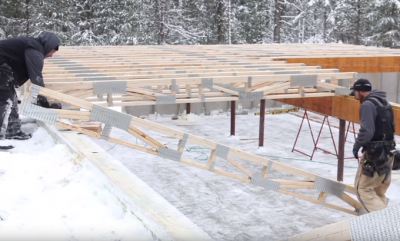 Builders installing floor trusses