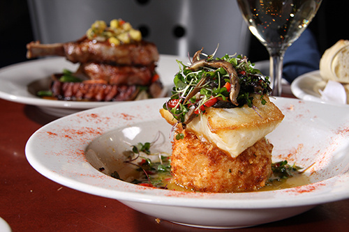 Dinner plates with food featured from the Elevator brewery and draught haus