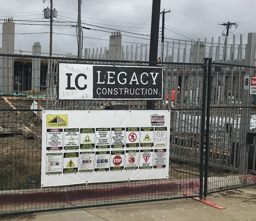 Safety banner hanging at a Legacy Construction jobsite