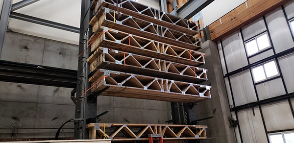 Weathered trusses being stored in a building