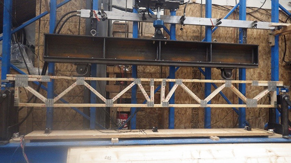 Trusses being preloaded to design load