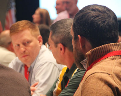 BCMC attendees in conversation at a session.