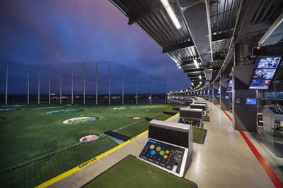 Image of Topgolf driving range at sunset