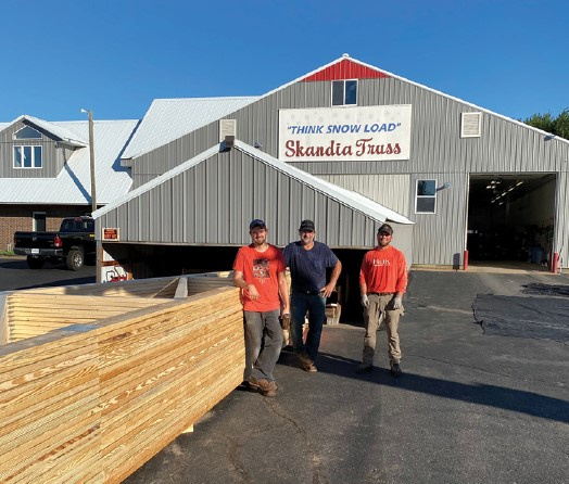 Skanida Truss building with three employees at the front